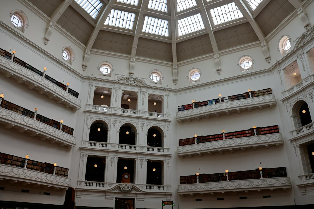 Grand library hall with arched shelves
