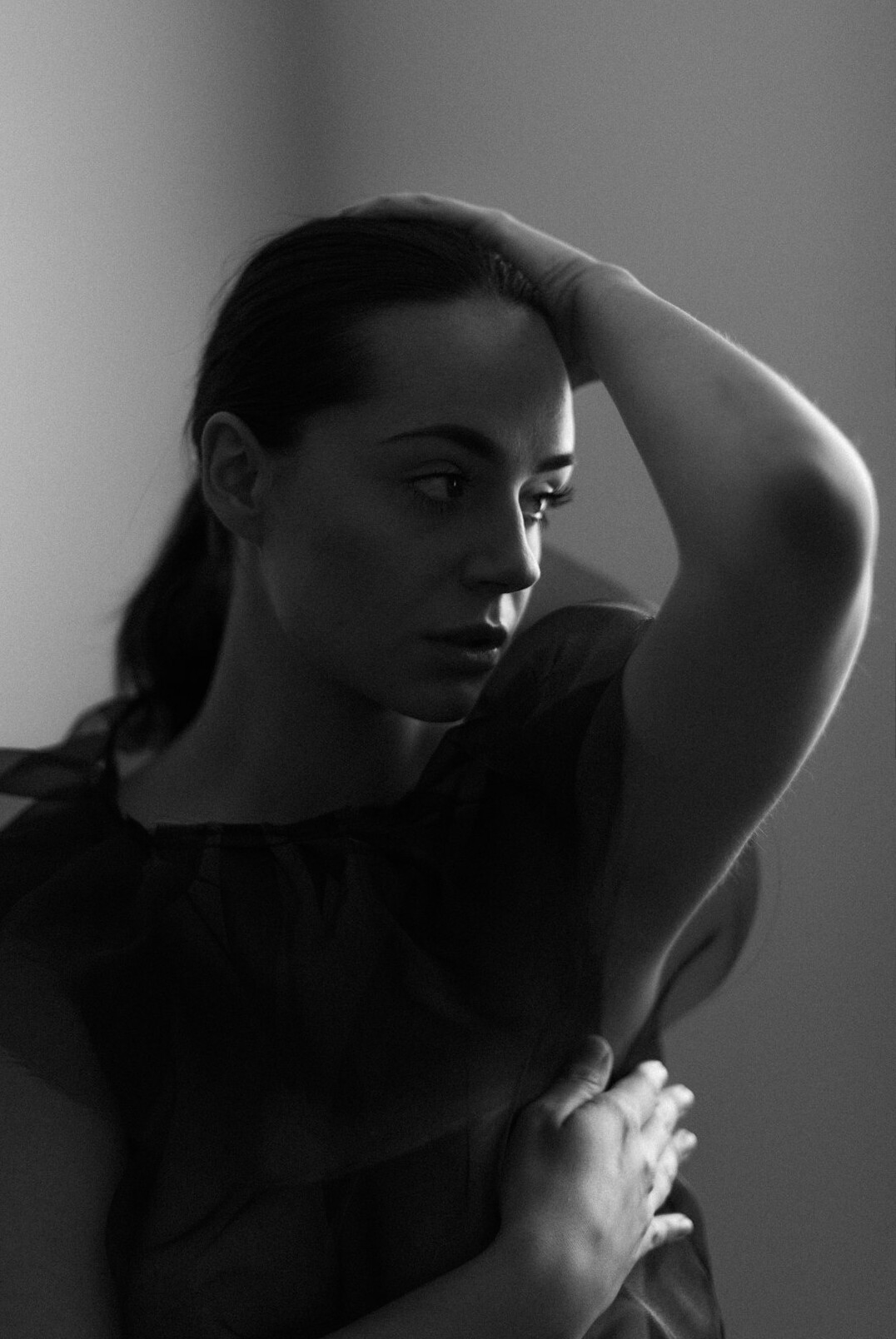 Portrait of a woman with dark hair in a studio